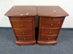 A pair of Willis and Gambier three drawer bedside chests with slides in a mahogany finish