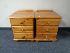 A pair of pine thee drawer bedside chests