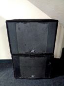 A pair of Peavey Pro-Sub PA speakers