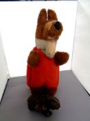 A 20th century Basil Brush soft toy together with a Japanese wind up mechanical bear