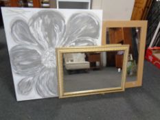 A pine framed mirror together with a gilt framed mirror and an unframed oil on canvas, flower,