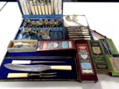 A tray of assorted boxed and cased cutlery to include tea spoons, butter knives,