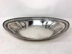 A pierced oval dish stamped Sterling, width 24.