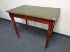 An Edwardian office table with a green leather inset panel