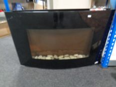 A wall mounted electric fire together with a Coopers electric heated clothes airer