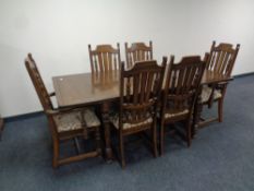 An old colonial style refectory extending dining table with leaf together with a set of six