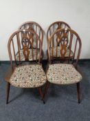 A set of four Ercol Fleur De Lys chairs in an antique finish