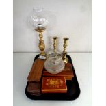 A tray containing two pairs of antique brass candlesticks,