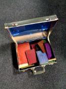 A 20th century vintage luggage case containing assorted antique and later books,