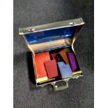 A 20th century vintage luggage case containing assorted antique and later books,