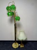 A contemporary brass five way floor lamp with green glass shades together with a brass Corinthian