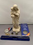 A mixed lot including religious statue, royal wedding commemorative coin, three gilt T-bars,