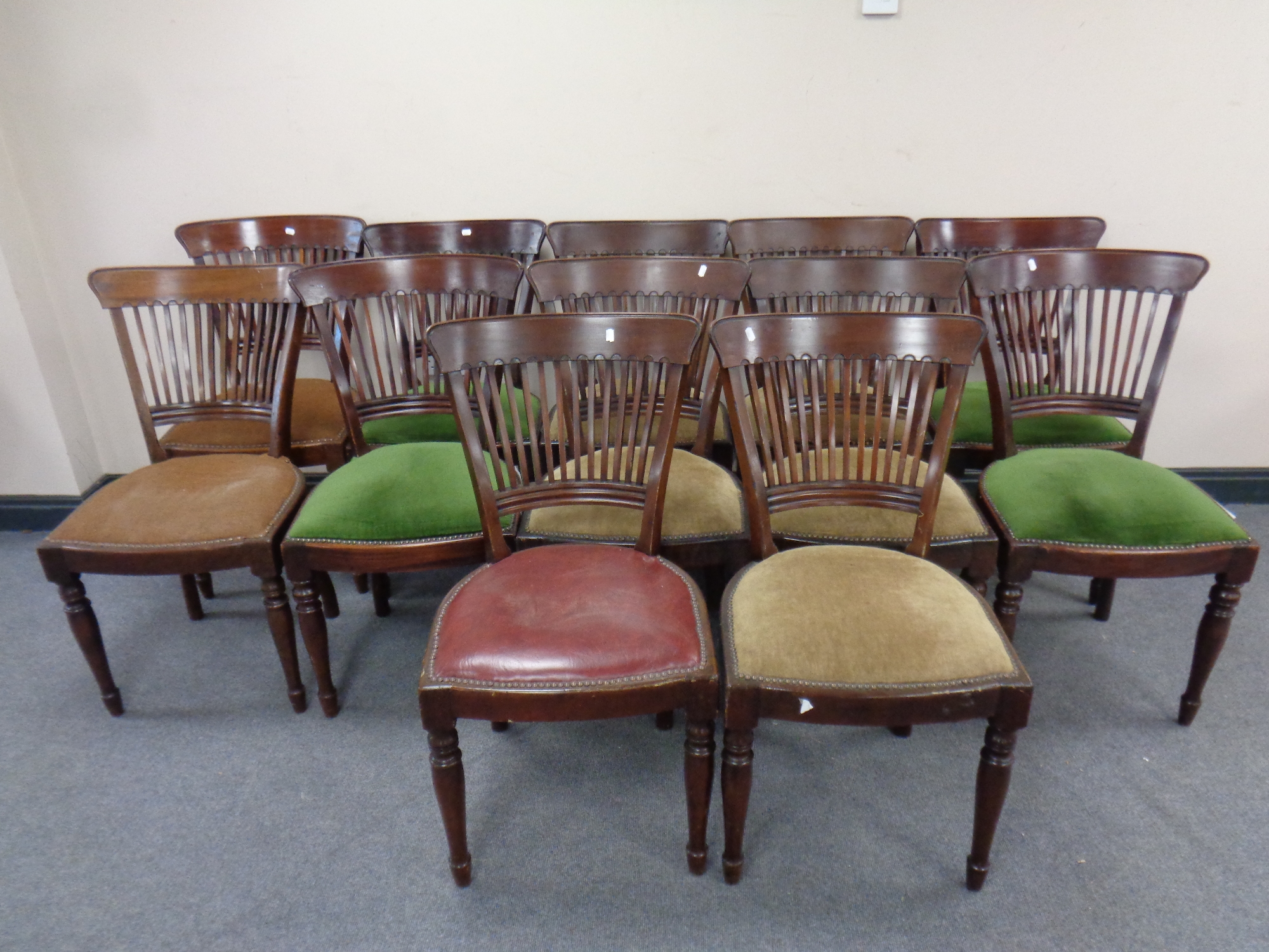 A set of thirteen late 19th century dining chairs (one damaged)