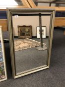A contemporary silvered framed mirror,
