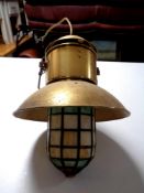 A 20th century brass ship's style pendant light fitting with leaded glass shade