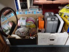 Two crates of miscellany to include wall plates, tins, vintage mobile phone, kitchen scales,