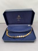 A Lotus Classic necklace in box