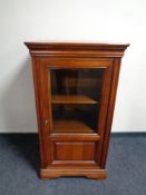 An audio cabinet in a mahogany finish