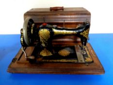 A 20th century Jones hand sewing machine in case