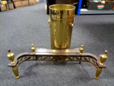A brass lion mask handle stick pot together with a cast iron and brass fire front