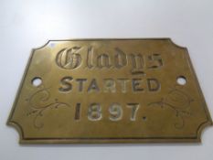 A 19th century brass plaque Gladys Started 1897