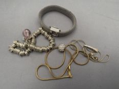 Two costume bracelets together with two pendants on chains