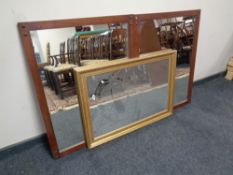 A gilt framed mirror together with a pair of contemporary framed mirrors in a mahogany finish