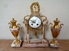 A three piece antique French decorative brass and marble clock garniture with pendulum and key