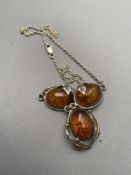 A vintage silver and amber necklet