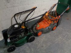 A Flymo electric lawn mower with grass box together with a petrol lawn mower