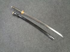 A reproduction Japanese katana in scabbard
