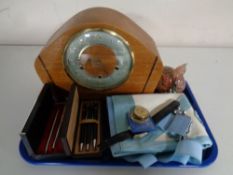 A tray containing miscellaneous to include glass paperweight, Smiths mantel clock,