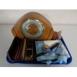 A tray containing miscellaneous to include glass paperweight, Smiths mantel clock,