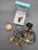 A mixed lot of costume jewellery to include necklaces, earrings, brooches, Smiths pocket watch,