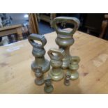 A set of seven 19th century brass graduated weights