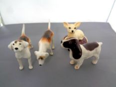 Four Beswick dog figures, Foxhound No. 2262, Foxhound No.