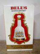 A Bell's Scotch Whisky decanter by Wade to commemorate The Wedding of H. R. H.