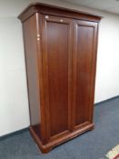 A Willis and Gambier double door wardrobe in a mahogany finish