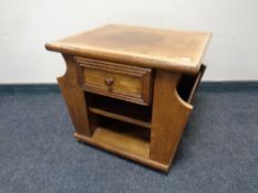 A pine bedside stand fitted a drawer together with an oak magazine occasional table