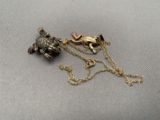 A vintage silver marcasite frog together with a further 9ct gold frog pendant on 9ct gold chain