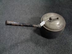 A 19th century cast iron lidded pan