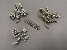 Four diamante costume brooches