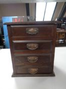 A mahogany Arts and Crafts four drawer counter top chest