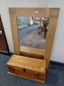 A contemporary oak framed overmantel mirror together with a small pine storage box