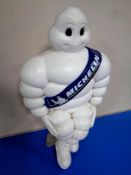 A plastic Michelin figure on metal mounting stand (official Michelin product)