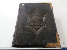 A 19th century leather bound national Holy Bible with colour lithographic book plates