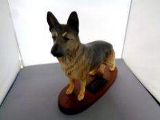 A Beswick figure, Alsatian German Shepherd dog on wooden plinth No.