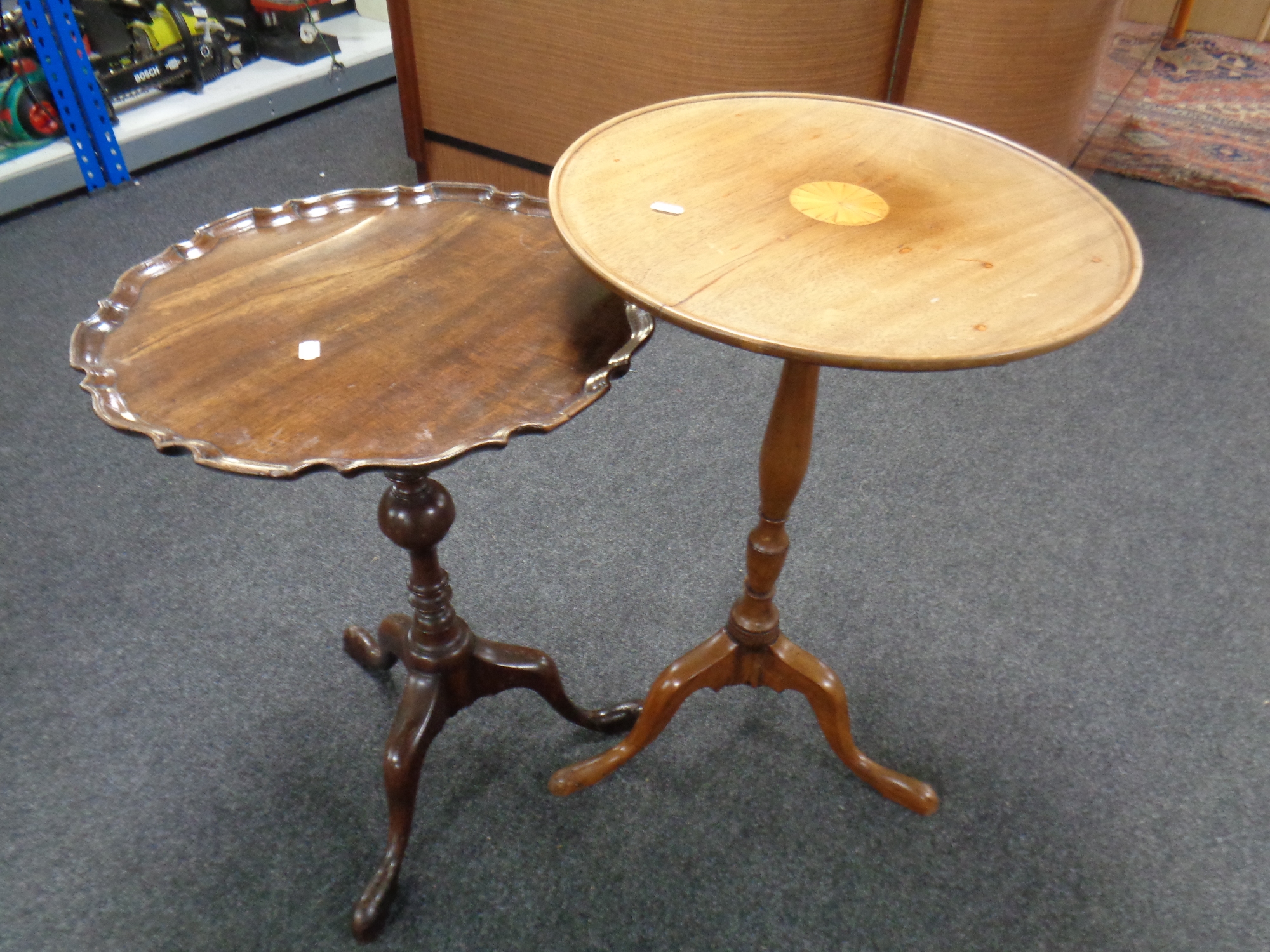 A 19th century inlaid mahogany pedestal wine table together with a further pie crust edge wine