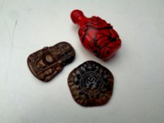 Two Chinese soapstone carvings together with a carved resin opium flask