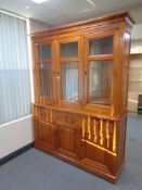 A Barker and Stonehouse cherry wood triple door bookcase fitted cupboards and drawers beneath ,